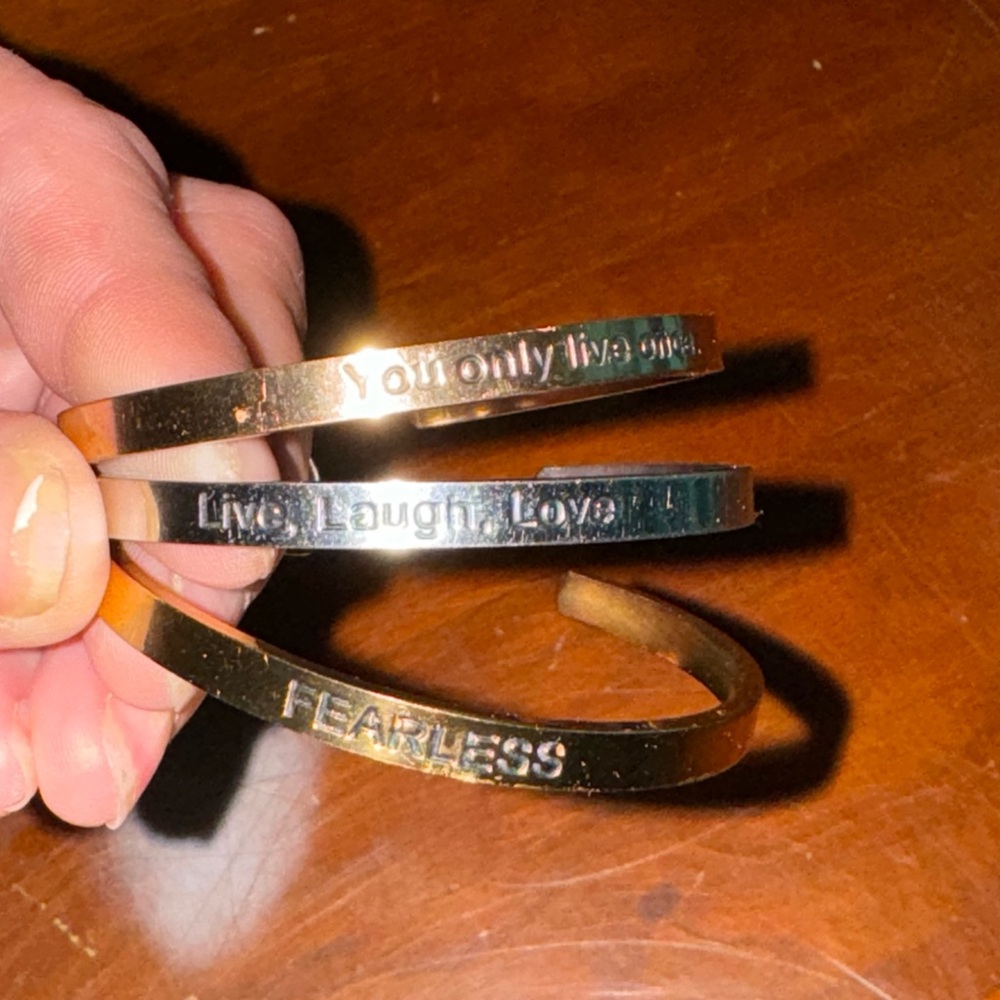Stainless steel adjustable cuff bracelets.